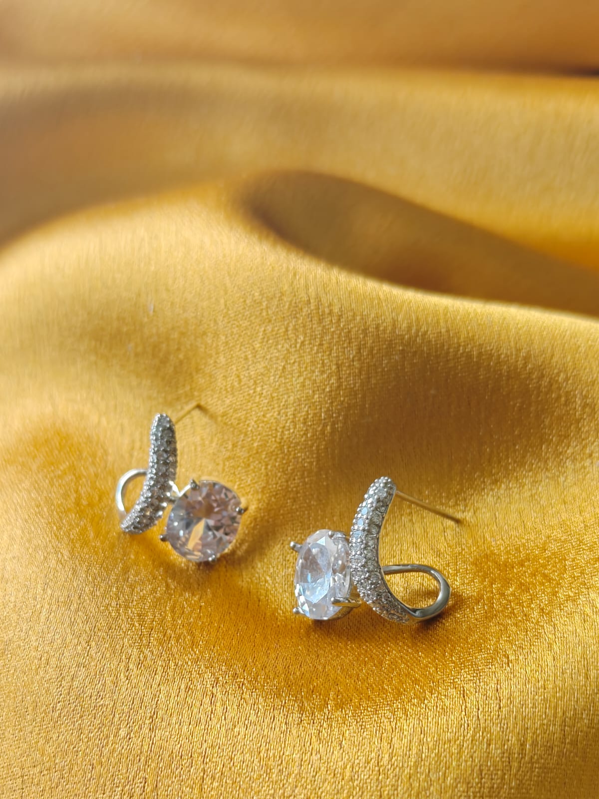 Close-up silver plated oval CZ stone earrings – minimalist statement jewellery for women – Oneofé