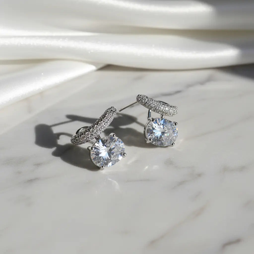 Close-up silver plated oval CZ stone earrings – minimalist statement jewellery for women – Oneofé