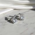 Close-up silver plated oval CZ stone earrings – minimalist statement jewellery for women – Oneofé