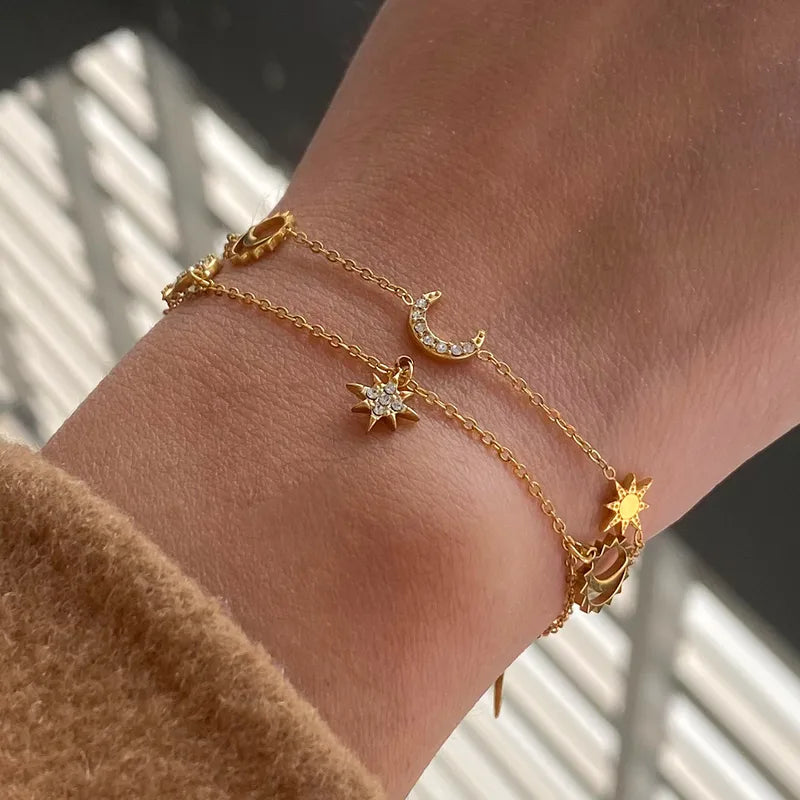 Gold plated anti-tarnish star moon charms bracelet on model — waterproof everyday jewellery for women India