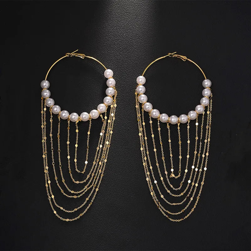 Gold-tone freshwater pearl hoop earrings with layered chain tassels on black – statement earrings for women – Oneofé