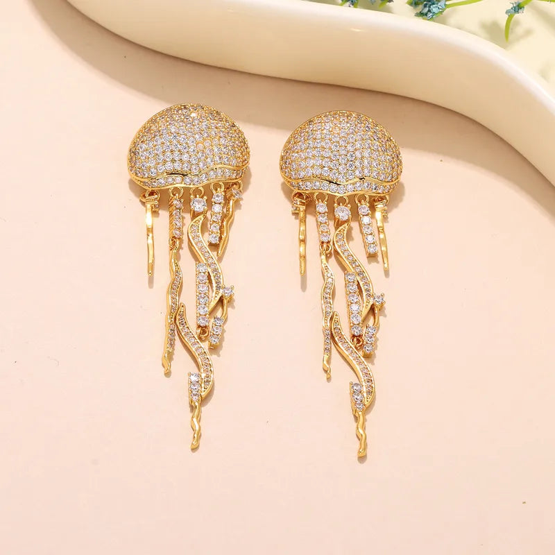 Gold Plated Zircon Ocean Tassel Drop Earrings flat lay detail – dainty statement earrings for women – Oneofé