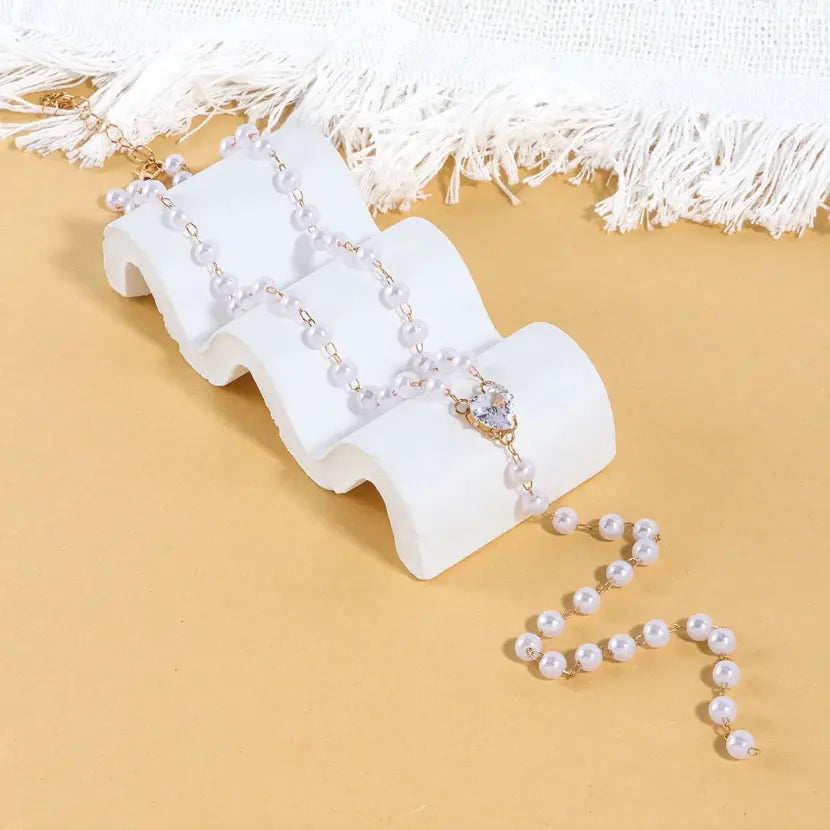 Faux Pearl Bead Heart CZ Y-Lariat Necklace on jewellery display – dainty gold plated collarbone necklace for women – Oneofé
