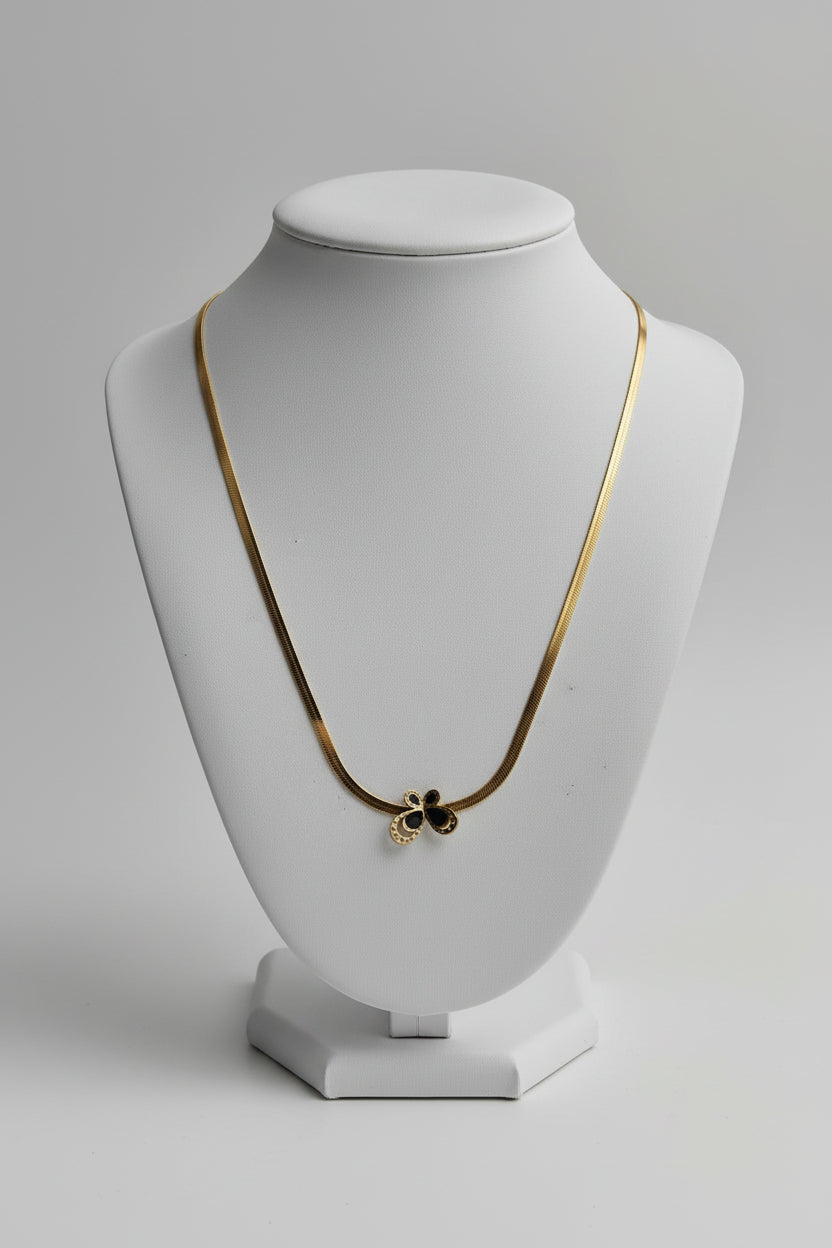 Close-up black butterfly pendant snake chain necklace – edgy statement jewellery for women – Oneofé
