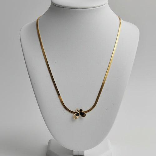 Close-up black butterfly pendant snake chain necklace – edgy statement jewellery for women – Oneofé
