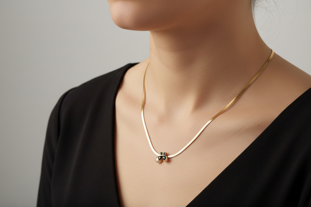 Close-up black butterfly pendant snake chain necklace – edgy statement jewellery for women – Oneofé