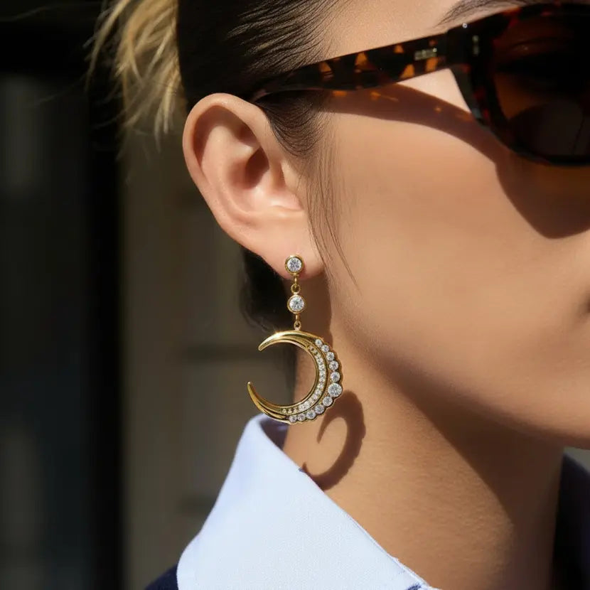 Gold Crescent Moon Zircon Drop Earring worn on model ear – minimalist everyday statement earring for women – Oneofé