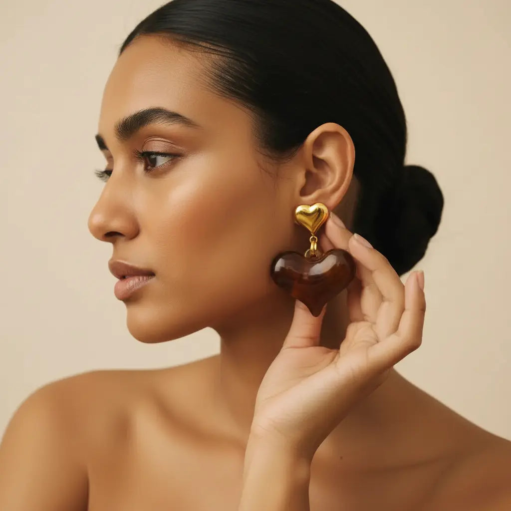 Handmade heart shape gold plated stud earrings angle view— everyday luxury  for women